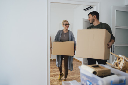 A couple with moving boxes